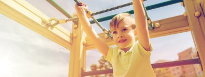 happy-little-boy-climbing-on-children-playground-PK7GUUB.jpg